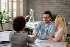 happy couple handshaking with financial advisor meeting office focus is man 637285 1136 happy couple handshaking with financial advisor meeting office focus is man 637285 1136